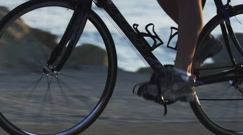 Cyclist by ocean Stock Footage 62890749