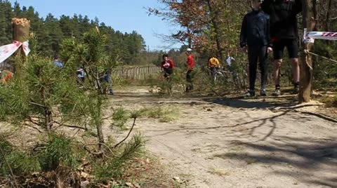 Cyclist passing start line Stock Footage 10804714