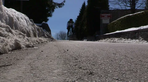 Cyclist pedaling on a pass Stock Footage 32317042