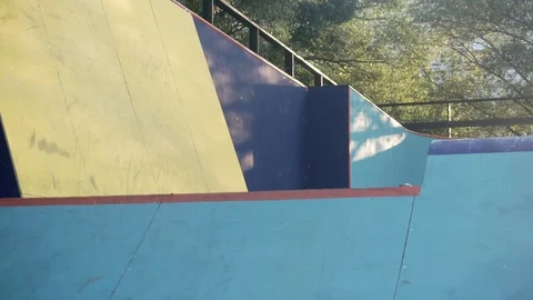 Cyclist perform a trick with ride on the wall in skate park 스톡 동영상 103244101