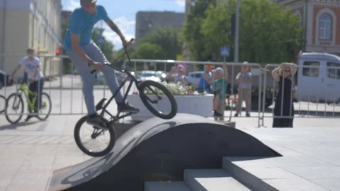 Cyclist performs the jump Stock Footage 81810137