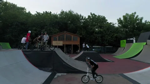 Cyclist performs trick at skate park Stock-Footage 102259840