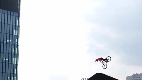 A cyclist performs tricks on a bicycle Stock Footage 245534464