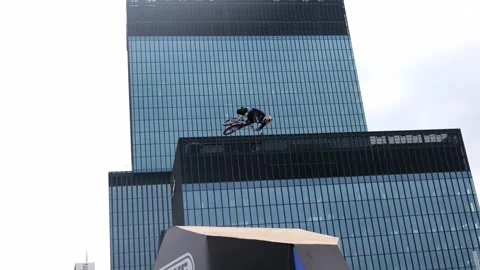 A cyclist performs tricks on a bicycle Stock Footage 245535760