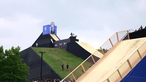 A cyclist performs tricks on a bicycle Stock Footage 245536783