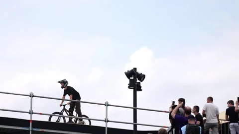 A cyclist performs tricks on a bicycle Stock Footage 245536785