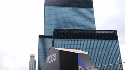 A cyclist performs tricks on a bicycle Stock Footage 245536843