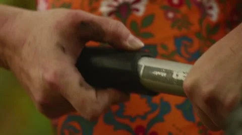 Cyclist pumping her tire in the forest slow motion Stock Footage 44237694