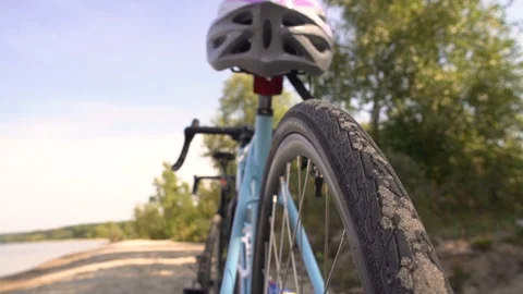 Cyclist puts on a helmet Stock Footage 98927877