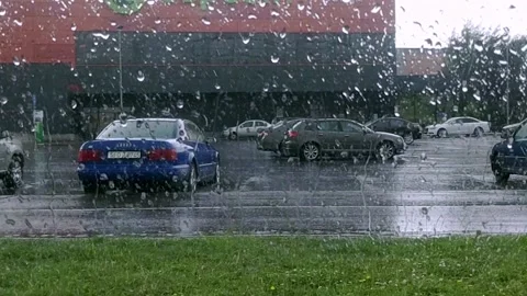 Cyclist in the rain through the window Stock Footage 167655095
