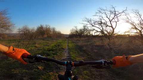 The cyclist rides along the path, video from the first person. Cycling. Stock Footage 158243251
