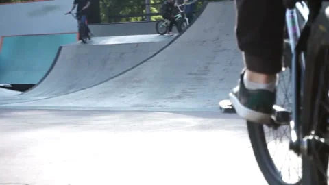 Cyclist rides forward and turns the bike in a jump 스톡 동영상 103649948