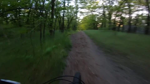 Cyclist rides at high speed on a trail with jumps fpv. Stock Footage 138025775