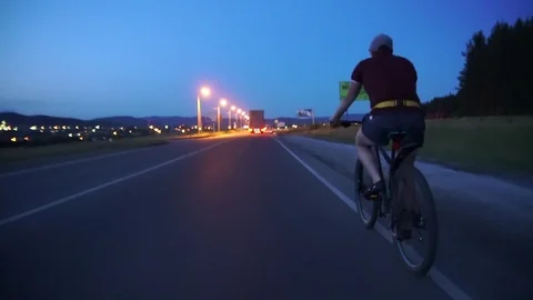 Cyclist rides on the highway Video stock 112989485