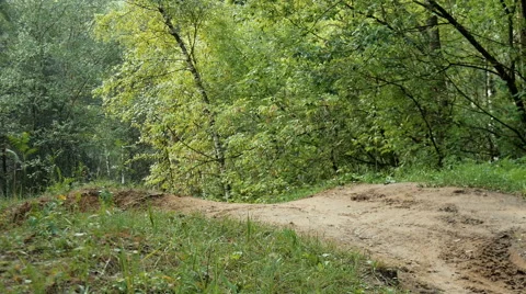 A cyclist rides on a small hill Stock Footage 65774095