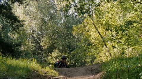 Cyclist rides through the forest Video stock 66150530