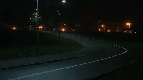 Cyclist rides through the park Stock Footage 76493992