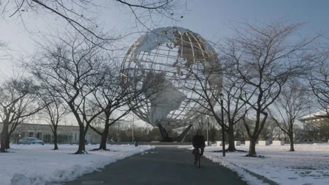 A cyclist rides through Queens Stock Footage 266115343