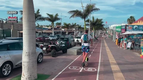 Cyclist riding along cycle path Corralejo Stock Footage 221427106