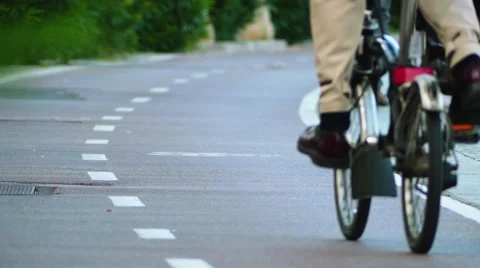 Cyclist riding on a bicycle path Stock Footage 63214170