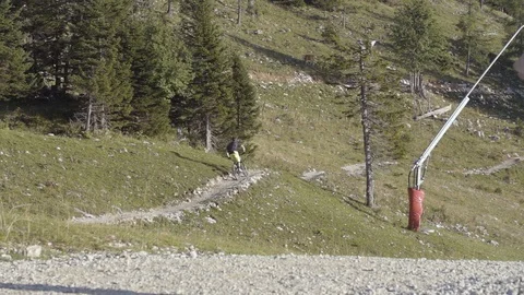 Cyclist riding mountain bike on mountain trail in slow motion Stock Footage 85820853