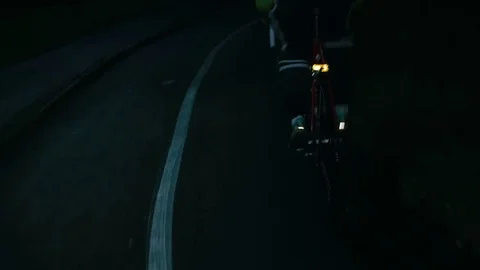 Cyclist riding at night close-up Stock Footage 76496589