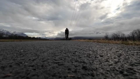 Cyclist Riding Over Camera on Wet Asphalt 스톡 동영상 329587950