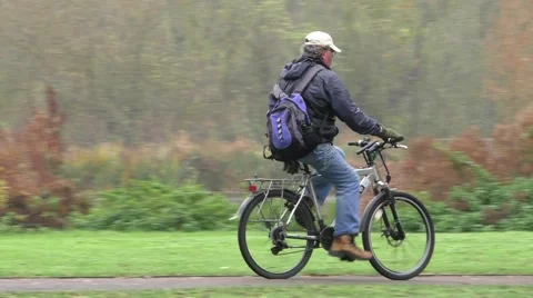 Cyclist riding on a path in park Stock Footage 44371428