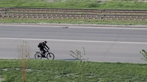 Cyclist riding a public road Video stock 131133232