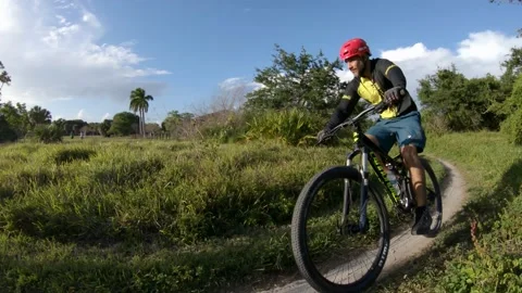 Cyclist Riding Right-to-Left into Sun Stock Footage 200797750