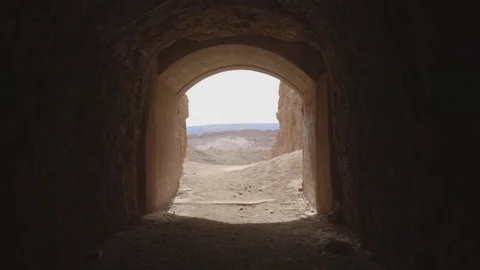 Cyclist riding through tunnel Stock Footage 79786129