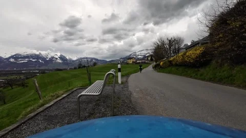 Cyclist Riding Toward Camera on Quiet Rural Path Near Bench Stock-Footage 330902902