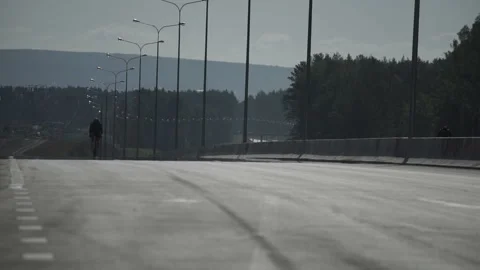 Cyclist on the road Stock Footage 86946289