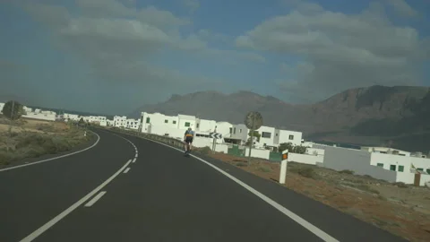 Cyclist on the road in Lanzarote Stock Footage 171272500