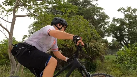 Cyclist Rounds Bend Video stock 204048902