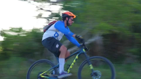 Cyclist Rounds Trail Backlit 15 Fps Stock Footage 203307411