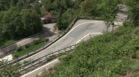 A cyclist runs a climb Stock-Footage 59123604