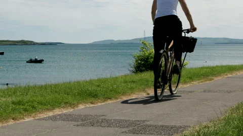 Cyclist by the sea Stock Footage 311009381
