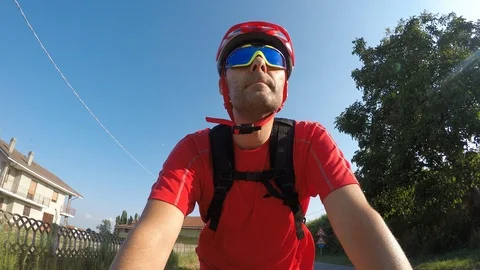 Cyclist seen from below with protective helmet and glasses Stock Footage 118886570
