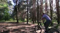 cyclist slow ride in wood. HD Footage