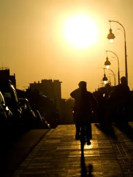 Cyclist at sunset Stock Photos
