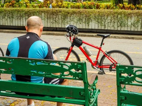 Cyclist taking a break. Stock Photos
