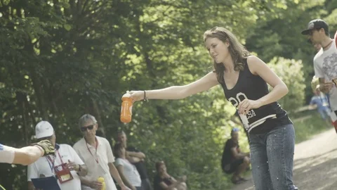 Cyclist taking water while racing Stock Footage 100649699