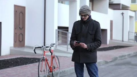 Cyclist talking on the phone Stock Footage 71463617