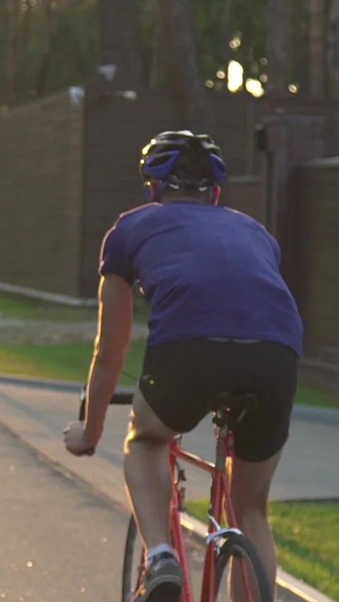 A cyclist trains before a competition. Or an active break after a sedentary day Stock-Footage 333621956