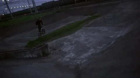 Cyclist is trying to do the trick and fails Stock Footage 103043667