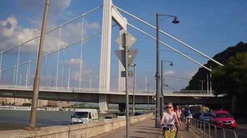 Cyclists and bridge in Budapest Stock Footage 80935170