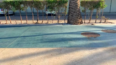 Cyclists  and runners passing by the camera Stock Footage 131473779