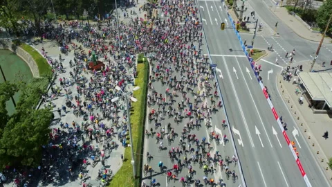 Cyclists approach crowded start area during major public cycling event in Sofia 스톡 동영상 335164304