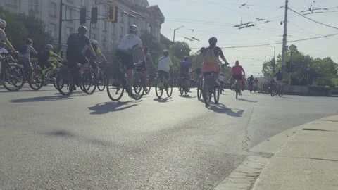 Cyclists are riding along the boulevard in a bicycle procession Stock Footage 346375376